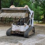 in-construction-work-bobcat-mini-loader-is-moving-2024-01-08-21-27-07-utc